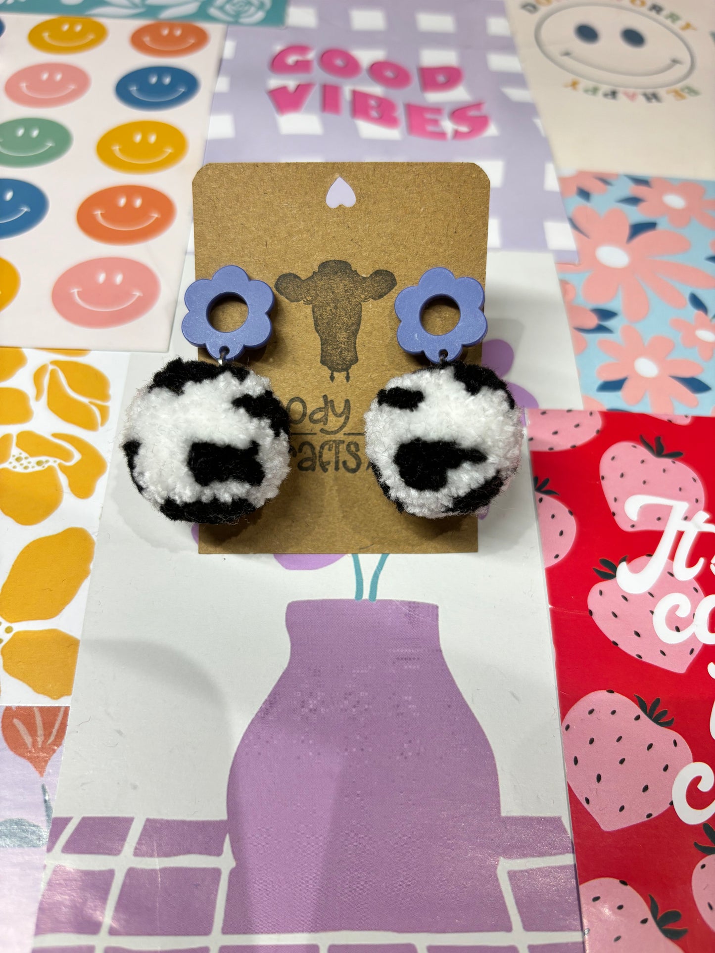 Black Cow Print Pom Pom Earrings