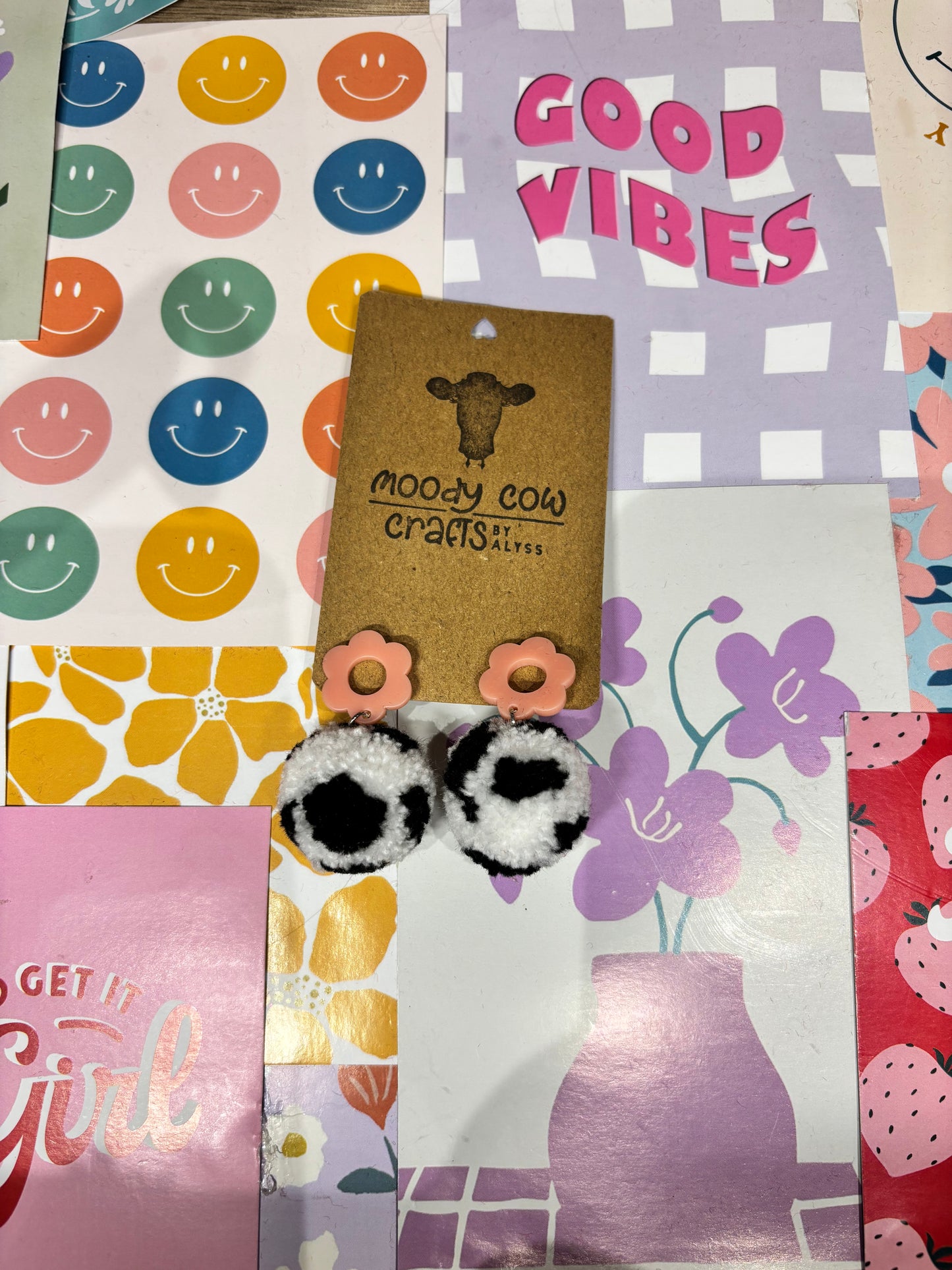 Black Cow Print Pom Pom Earrings